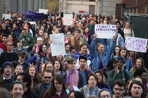 Several hundred demonstrators have marched on Syracuse University and State University of New York College of Environmental Science and Forestry campuses as part of national 