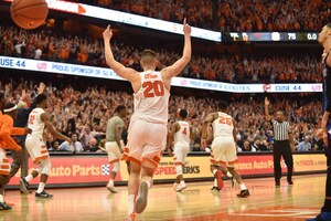Tyler Lydon sprints to hero John Gillon after he banked in a buzzer-beating 3-pointer.