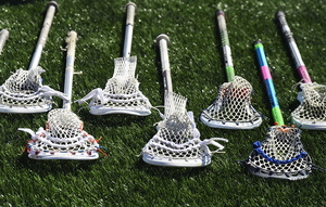 Many of the Syracuse lacrosse players have different ways they like to have their sticks strung.