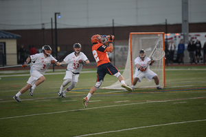 Jordan Evans jumps and fires at goal. The Orange offense exploded, leading to a sizable victory. 