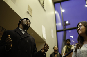 Ryan Bolton, a freshman computer science and engineering major, sings “A Change is Gonna Come” by Sam Cooke in the lobby of Crouse-Hinds Hall after the building locked at 5 p.m. for the weekend. Protesters could remain in Crouse-Hinds Hall over the weekend but could not gain re-entry until Monday morning. 