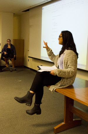 Aysha Seedat, Student Association president, speaks at Monday night’s SA meeting in the Hall of Languages. Most notably, SA talked about the Wednesday shooting.   