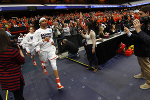 Syracuse players jog onto the court in the Carrier Dome against Albany. SU has won twice since beating UA to make its first Final Four.