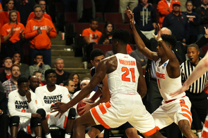 Tyler Roberson and Frank Howard trap a Gonzaga player during the teams' matchup on Friday. The press guided Syracuse to its Sweet 16 win. 