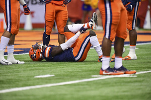 Trill Williams lies on the field with an injured left leg. The Orange lost multiple defensive players due to injury in Friday night's loss to Pittsburgh. 