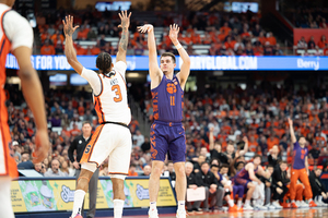 Former Syracuse guard Joe Girard III led Clemson with 18 points to help defeat the Orange 77-68.