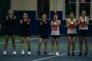 Viktoriya Kanapatskaya (second from left) and Miyuka Kimoto (third from left) were eliminated in the round of 32 of the 
NCAA Doubles Championship Tuesday.