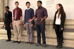 Jonathan Reyes (second from right), a junior in the College of Arts and Sciences, speaks about multicultural issues during Mondays student association meeting in Maxwell Auditorium.