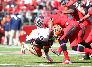 Wide receiver Alec Lemon is brought down after making a catch.