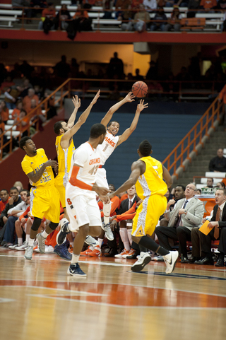 Michael Carter-Williams attempts to keep the ball in bounds.