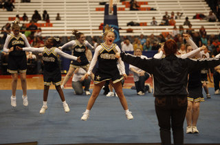 The Comets jump for joy, performing their routine at halftime on Friday.