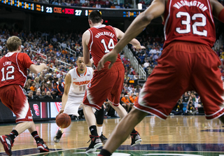 Ennis navigates through N.C. State's defense while scanning the floor. 