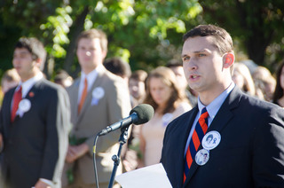 John Tummino, a dual political science and broadcast and digital journalism major and Remembrance Scholar, introduces the Rose Laying Ceremony on Friday in front of the Hall of Languages.