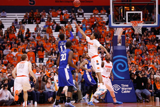 Powers shoots over Gbinije in the first half as Christmas gets in position for the rebound.