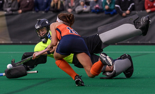 Syracuse senior forward Lauren Brooks tries to dodge UConn goalkeeper Nina Klein and get a shot off. 