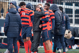 Associate head coach Jukka Masalin comforts a distraught Pieles.