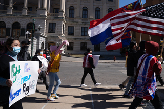 Demonstrators march through downtown Syracuse.